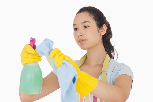 Eco-friendly office cleaning supplies on a workspace